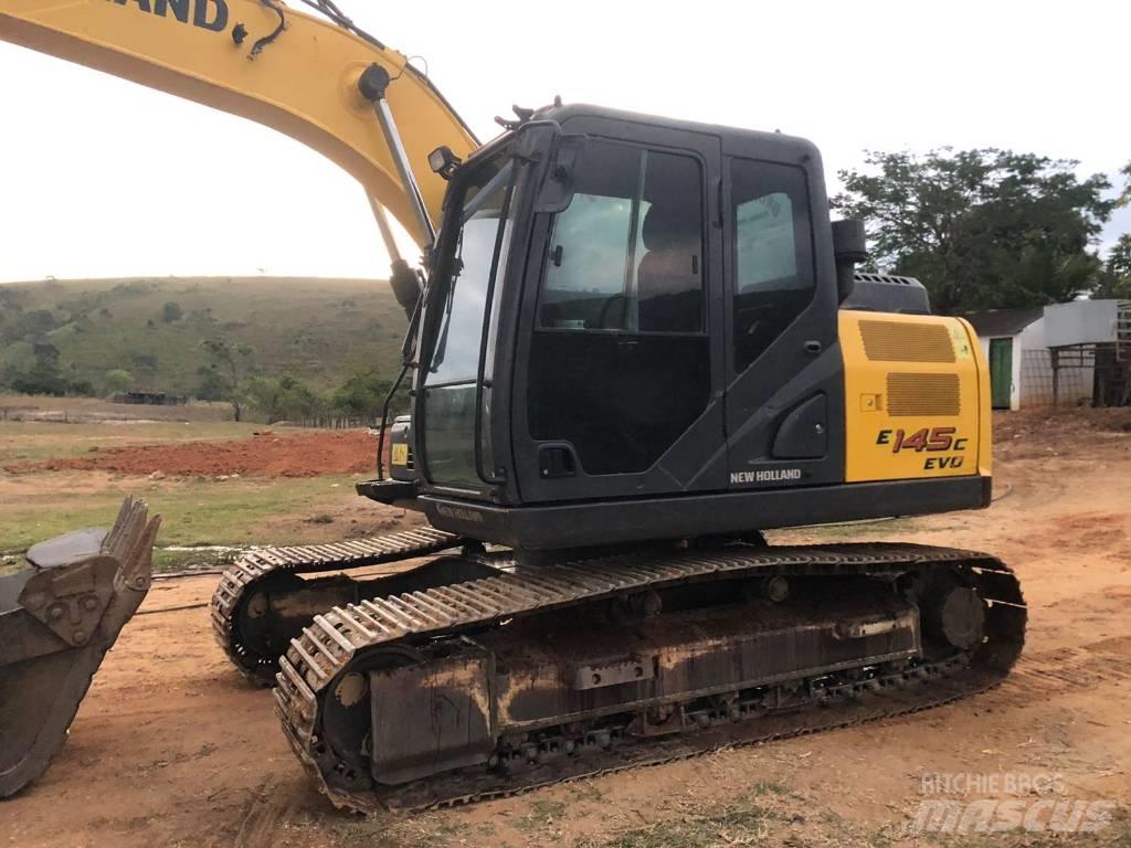 New Holland E 145 Bageri gusjeničari