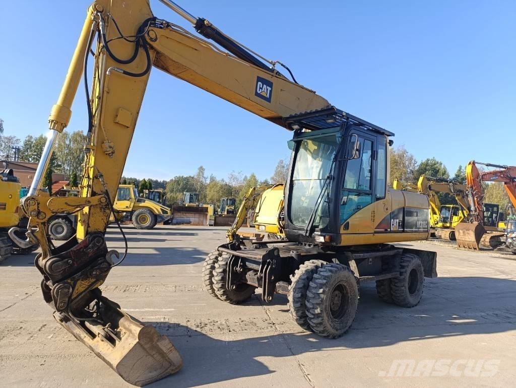 CAT M 318 C Bageri na kotačima