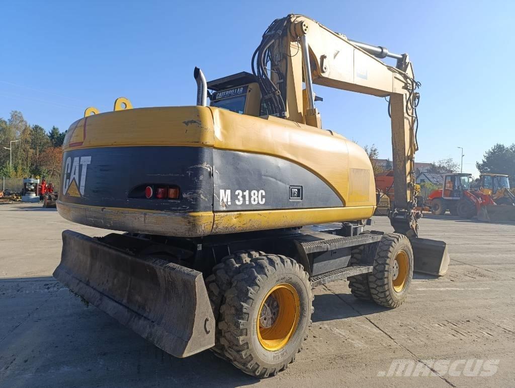 CAT M 318 C Bageri na kotačima