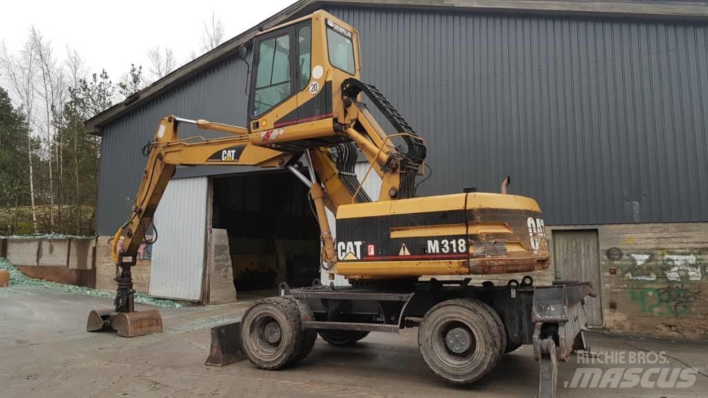 CAT M 318 Bageri za manipuliranje materijalom / otpadom