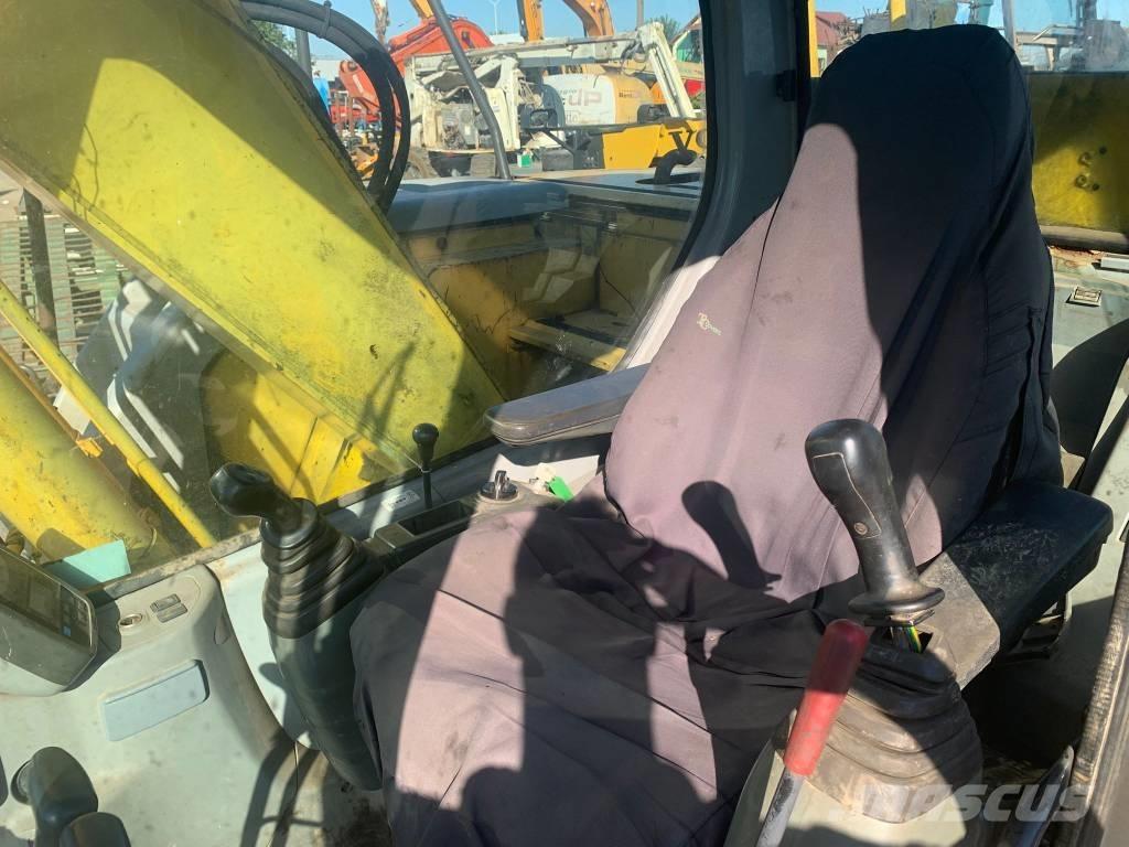 New Holland E 135 SR Bageri gusjeničari