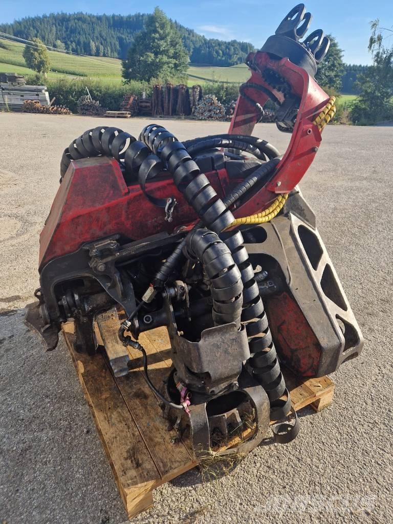 Komatsu 124 Strojevi za kleščenje grane drveća