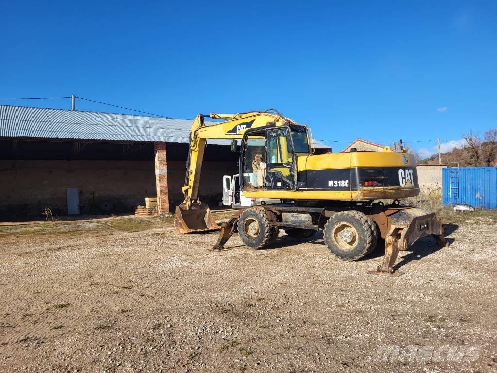 CAT M318c Bageri na kotačima