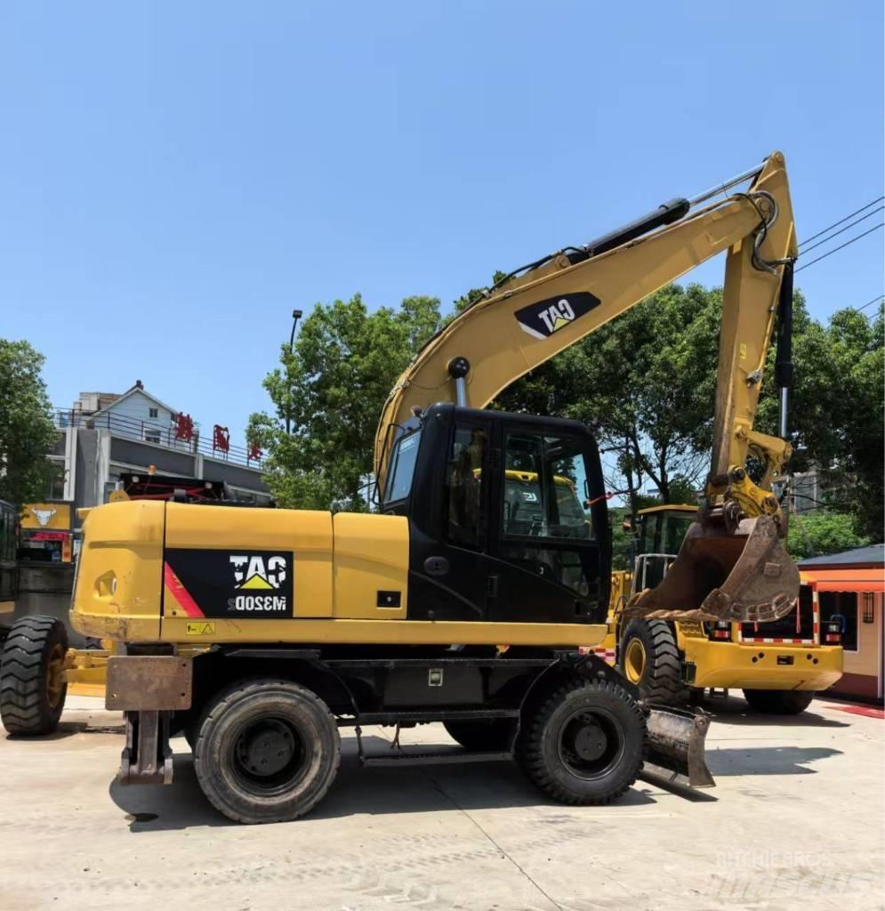 CAT M 320 Bageri na kotačima