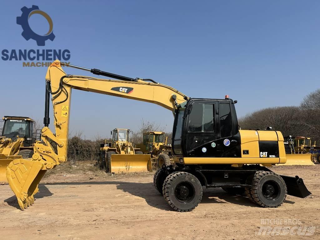 CAT M 320 D2 Bageri na kotačima