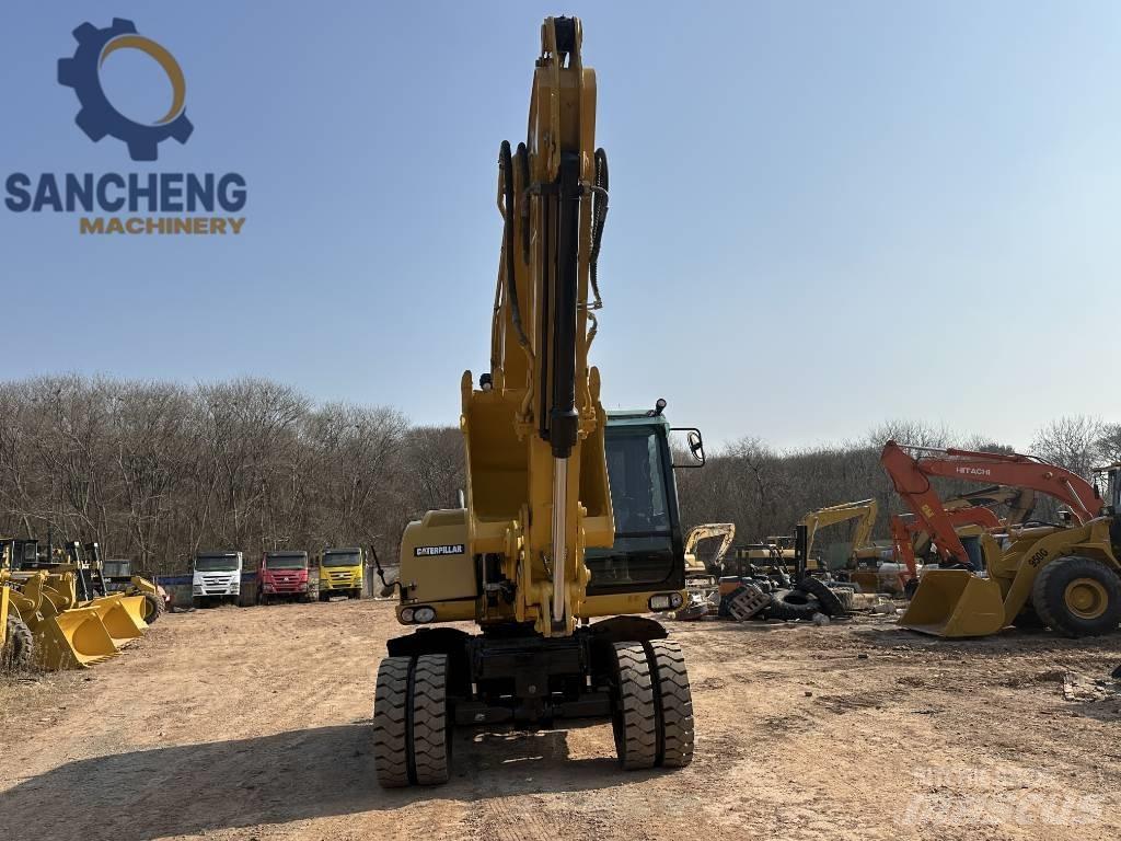 CAT M 320 D2 Bageri na kotačima