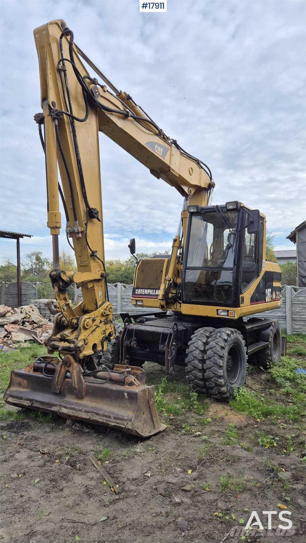 CAT M312 Bageri na kotačima