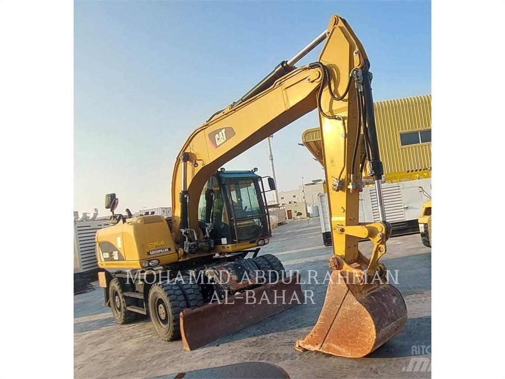 CAT M320D2 Bageri na kotačima