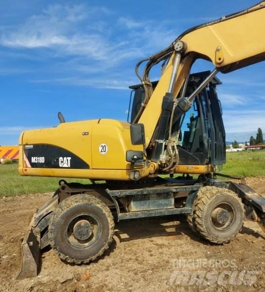CAT M318 D Bageri na kotačima