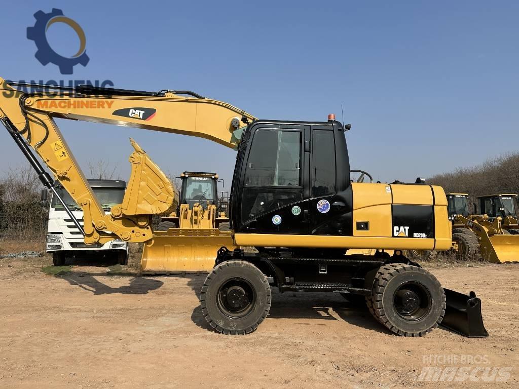 CAT M 320 D2 Bageri na kotačima