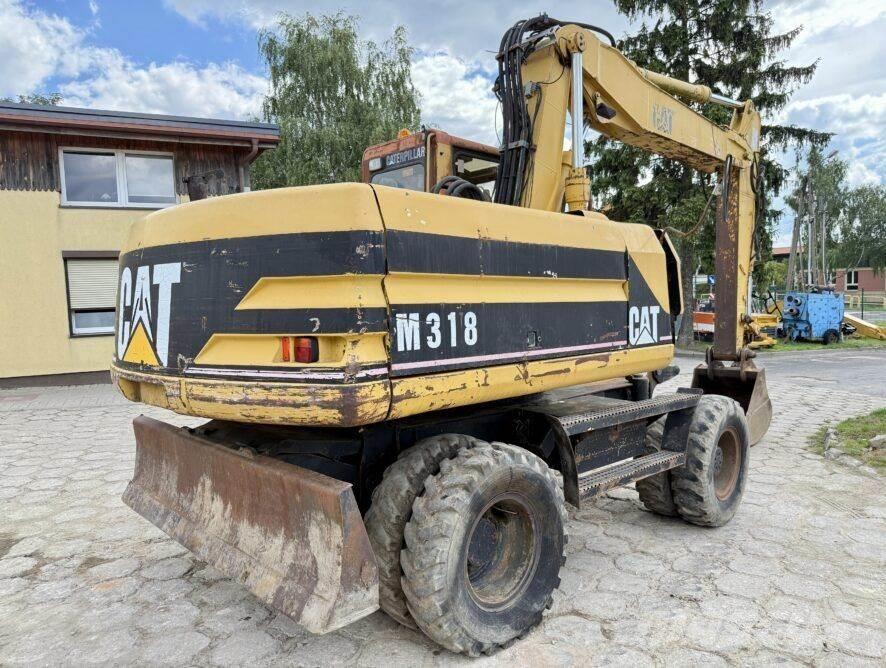 CAT M318 Bageri na kotačima