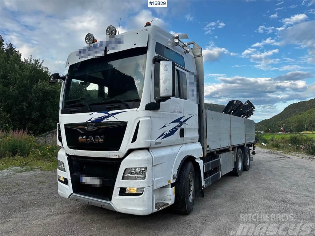 MAN TGX 26.560 Flatbed truck with Hiab 138 crane from  Kamioni sa otvorenim sandukom